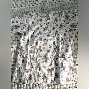 Bundle TWO scrub tops. Brand new, never worn. Cute designs.